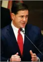  ?? ASSOCIATED PRESS FILE PHOTO ?? GOV. DOUG DUCEY HAS PROPOSED a $12.3 billion budget. On paper, the spending plan includes $608 million in new K-12 funding.