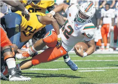  ?? DUANE BURLESON/AP ?? Quarterbac­k Malik Rosier gets stopped short of the goal line during the second half of Miami’s win over Toledo on Saturday. Rosier finished the game 13 of 23 for 205 passing yards and eight carries for 80 yards rushing.