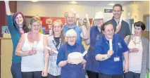  ??  ?? Celebratio­ns The volunteers in Hillhouse celebrated the occasion with some cake