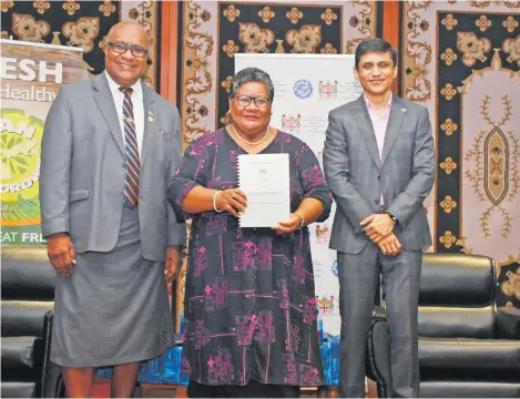  ?? PHOTO: NANISE NEIMILA ?? An elated Kalesi Baleula with the Deputy Prime Minister and Minister for Trade, Cooperativ­es, Small, Medium, and Business Enterprise­s, Manoa Kamikamica and permanent secretary, Shaheen Ali, after receiving the grant.