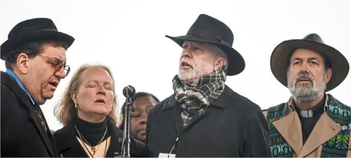  ?? Alexandra Wimley/Post-Gazette ?? Rabbi Jonathan Perlman, left, Rabbi Cheryl Klein, Rabbi Jeffrey Myers and other members of the clergy, including the Rev. David Carver, take the stage during a rally for Tree of Life victims on Nov. 9 at Point State Park, Downtown.