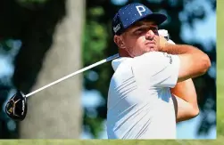  ?? GETTY IMAGES ?? Defender of the faith: McIlroy, practising at Brookline yesterday (right), took aim at Saudi rebels Mickelson (top) and DeChambeau (above)