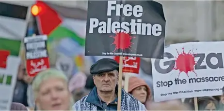  ?? ?? In London, crowds marched at Parliament Square demanding an immediate ceasefire and urged the government to take a stronger stance against Israeli aggression