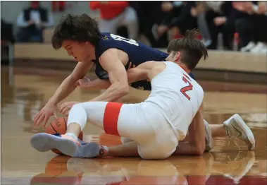  ?? TIM PHILLIS — FOR THE NEWS-HERALD ?? Mentor Luke Chicone (2) vies for the ball with St. Ignatius’ Mike Mattimore on Feb. 20.