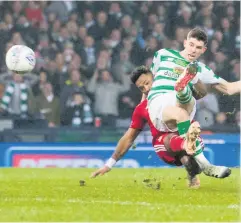  ??  ?? Winning strike: Ryan Christie fires home Celtic’s goal