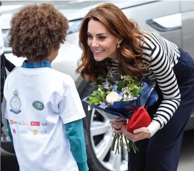  ??  ?? Shipshape Kate: The Duchess of Cambridge, accompanyi­ng her husband, was given flowers