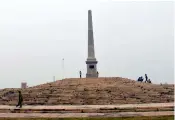  ?? — PTI ?? A man walks past the coronation pillar to mark the 1911 Delhi Durbar where King George V announced shifting of capital from Calcutta to New Delhi.