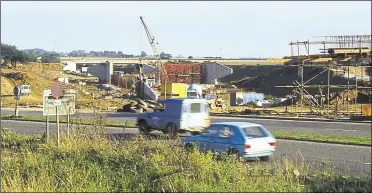  ?? Picture: Neville Marsh ?? The dualled bypass section beside The Street, Willesboro­ugh, continues to flow while the Junction 10 interchang­e is built in 1979