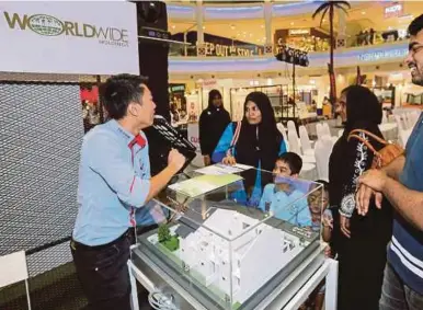  ??  ?? Potential buyers at one of the booths at The Curve in Mutiara Damansara yesterday.