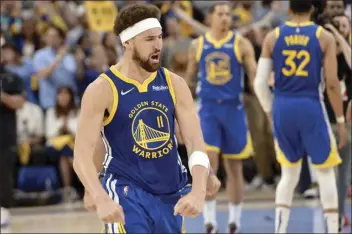  ?? AP photo ?? The Warriors’ Klay Thompson celebrates after Golden State’s 117-116 win over the Grizzlies in Game 1 of their Western Conference semifinal series Sunday.