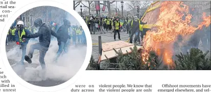  ??  ?? Yellow Vests kick tear gas back towards police, and set fire to Christmas trees