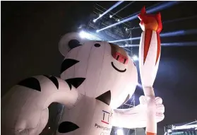  ??  ?? SOOHORANG THE TIGER, Olympic mascot, denoting strength