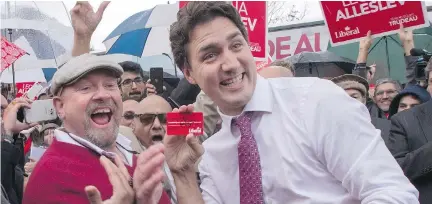  ?? PAU L C H I A S S O N / T H E C A NA D I A N P R E S S ?? Justin Trudeau is a natural rock star politician who never takes a bad photo, Josh Freed writes.