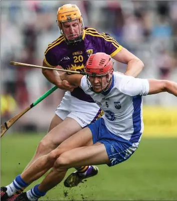  ??  ?? Waterford sweeper Tadhg de Búrca, who was sent-off late in the game, wins this tussle with Wexford’s Podg