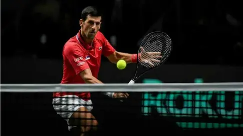  ?? AFP/VNA Photo ?? NET GAIN: Novak Djokovic returns the ball to Kazakhstan's
Alexander Bublik.