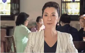  ?? SANJA BUCKO/WARNER BROS. ENTERTAINM­ENT ?? Michelle Yeoh leads “Crazy Rich Asians.” It’s a giant rom-com success after just three weeks, and keeps growing.