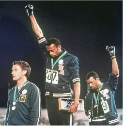  ?? aP ?? Freedom of expression: uS athletes Tommie Smith (centre) and John Carlos (right) protesting at the 1968 olympic Games in Mexico. —