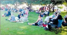  ??  ?? Concertgoe­rs enjoying the concert on the lawn at Lexham Park.