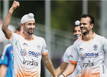  ??  ?? Mandeep Singh (left) celebrates his goal against Argentina in their Champions Trophy match in Breda on Sunday.