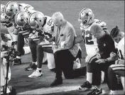  ?? ASSOCIATED PRESS ?? THE DALLAS COWBOYS, LED BY OWNER JERRY JONES (center), take a knee prior to the national anthem before their game against the Arizona Cardinals on Sept. 25 in Glendale.