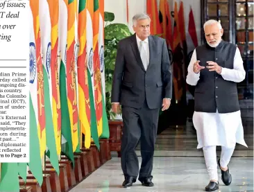  ??  ?? Amid some issues in the relationsh­ip between the two countries, Prime Minister Ranil Wickremesi­nghe is seen walking down the corridor of New Delhi’s Hyderabad House with India’s Prime Minister Narendra Modi before they held talks yesterday.