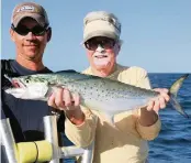  ?? STEVE WATERS For the Miami Herald ?? Capt. Richard Stanczyk of Islamorada holds a Spanish mackerel caught on a jig by Capt. Dave Peck while fishing near Sprigger Bank in the Gulf of Mexico.