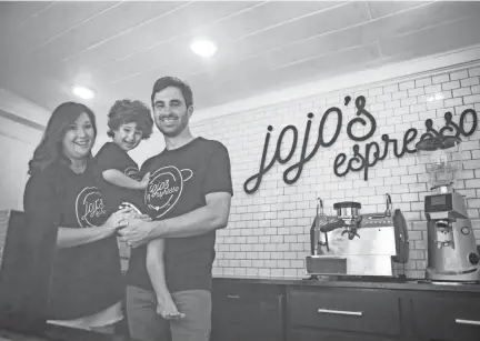  ?? ARIEL COBBERT/ THE COMMERCIAL APPEAL ?? Taylor Whiddon, his wife Hannah Faulkner Whiddon and their son Mason Whiddon pose inside their new coffee food truck Jojo's Espresso in Cordova, Tenn., on Tuesday, June 30, 2020.