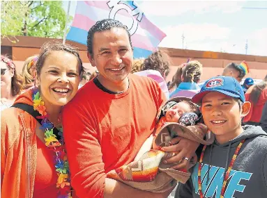  ?? WAB KINEW ?? Wab Kinew, holding infant son Tobasonakw­ut, with wife Lisa and older son Dominik at the 2018 Pride Winnipeg.