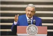  ?? FERNANDO LLANO APFILE ?? Mexican President Andrés Manuel López Obrador says he will sign into law legislatio­n that will cut funding to the country’s electoral agency.