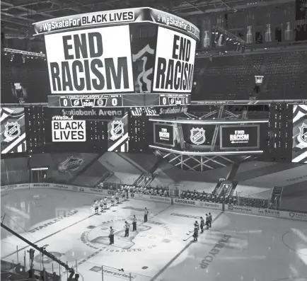  ?? FRANK GUNN/AP ?? An “End Racism” message is displayed before Game 3 of the NHL second-round playoff series between the Lightning and the Bruins on Wednesday.