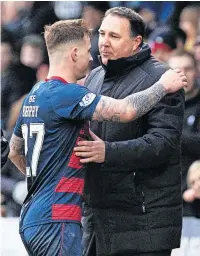  ?? ?? EAMONN HIGH Brophy hugs boss Malky Mackay