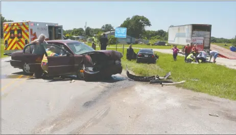  ?? Photograph­s courtesy of Brandon Davis ?? Two young children were injured in a wreck Monday afternoon. They were not properly secured in child restraint seats, according to police. Pea Ridge emergency personnel treated them and transporte­d them to Northwest Medical Center. A 3-year-old boy was...