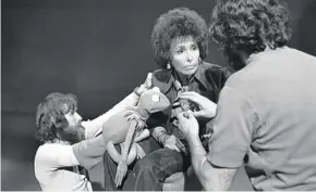  ??  ?? Jim Henson, left, holding a Kermit the Frog puppet, and Lena Horne rehearse the song “Bein’ Green” by Joe Raposo.