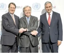  ??  ?? Greek Cypriot leader Nicos Anastasiad­es, left, UN SecretaryG­eneral Antonio Guterres, center, and Turkish Cypriot leader Mustafa Akinci, right, pose for a group picture during a new round of the conference on Cyprus under the auspices of the UN, in...