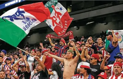  ?? Photos by Ronald Cortes / Contributo­r ?? Chivas de Guadalajar­a fans cheer their team during Sunday’s game against CF Monterrey at the Alamodome. Sunday’s event drew 14,317 fans to the stadium from as far away as Chicago. With a goal by Sergio Villarreal, Monterrey won the match 1-0.