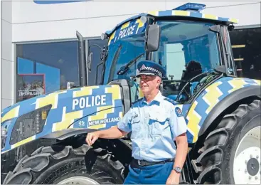  ?? Photo: EMMA JAMES. ?? Impact: Inspector Paul Carpenter stands with the new Police-branded tractor in Te Awamutu last week.
