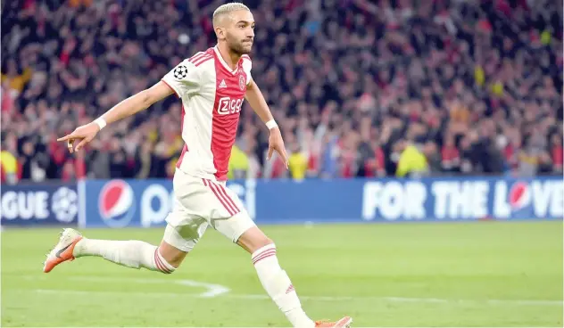  ?? File / Agence France-presse ?? ↑
Ajax end speculatio­n over Hakim Ziyech’s future by announcing the deal with Chelsea.