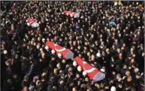  ?? THE ASSOCIATED PRESS ?? The coffins of bomb victims are carried during a memorial in Istanbul on Sunday for police killed outside the Besiktas football stadium Saturday.