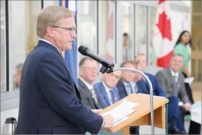  ?? NEWS PHOTO EMMA BENNETT ?? Minister of Education David Eggen speaks Wednesday during the Medicine Hat High School grand re-opening ceremony. Past and present staff and students attended the ceremony to celebrate the hard work by everyone involved in the school's modernizat­ion.