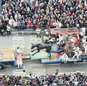  ?? Xolo leaves Liverpool, and crowds of fans, on his conveyor belt ??