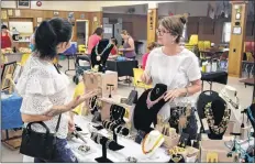  ?? CHRIS SAULNIER ?? Waterville resident Shannon Graves, left, enjoys making her own jewelry, and loves with the new Berwick market open, she has another spot to share her creations with the public.