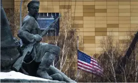  ??  ?? The US embassy with its national flag, seen behind a monument to the Workers of 1905 Revolution in Moscow, Russia. Photograph: Alexander Zemlianich­enko/AP