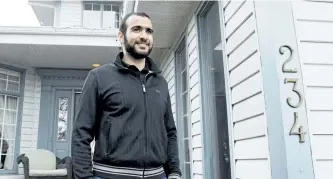  ?? THE CANADIAN PRESS FILES ?? Omar Khadr walks out the front door of his lawyer Dennis Edney’s home to speak the media in Edmonton, Ata., on May 7, 2015. The lawyer for the widow of an American soldier killed in Afghanista­n said Tuesday they have filed an applicatio­n so that any...