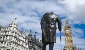  ?? (Reuters) ?? A STATUE of Winston Churchill stands in London’s Parliament Square.