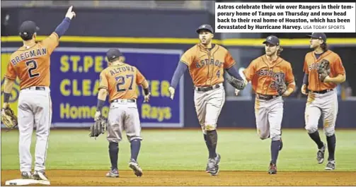  ?? USA TODAY SPORTS ?? Astros celebrate their win over Rangers in their temporary home of Tampa on Thursday and now head back to their real home of Houston, which has been devastated by Hurricane Harvey.