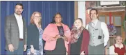  ??  ?? Ballard Betz (left) presents the DDA Economic Partnershi­p Award to staff members of the new Courtyard by Marriott.