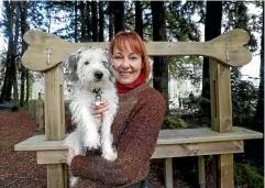  ?? MARTIN DE RUYTER/STUFF ?? Anne-Maree Therkleson with her dog Vincent at the Marsden Valley Dog Park in Nelson. She says dog walking is ‘‘definitely good for your mental health’’ – and helps Vincent burn off extra energy.