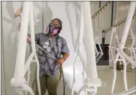  ?? MICAH GREEN — BLOOMBERG ?? An employee coats bicycle frames with powder paint at a production facility in Manning, South Carolina.