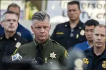  ?? ?? “That group of churchgoer­s displayed what we believe is exceptiona­l heroism and bravery,” Orange County Undersheri­ff Jeff Hallock, center, said at a news conference Sunday near Geneva Presbyteri­an Church in Laguna Woods, where a shooter entered the church and opened fire.
