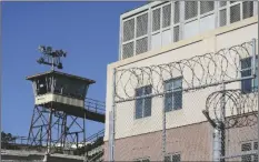  ?? ERIC RISBERG/AP ?? BARBED WIRE AND A GUARD TOWER is seen at San Quentin State Prison on April 12, 2022, in San Quentin, Calif.